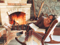 Woman,Reading,Book,And,Relaxing,By,The,Fire,Place,Some